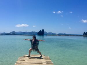 woman in warrior 2 pose in el nido