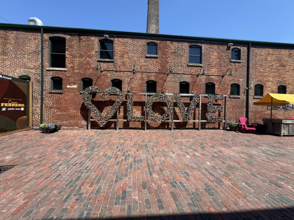 Distillery Historic District with a sign taht says love