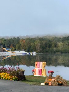 View of the lake with a Camp Social sign