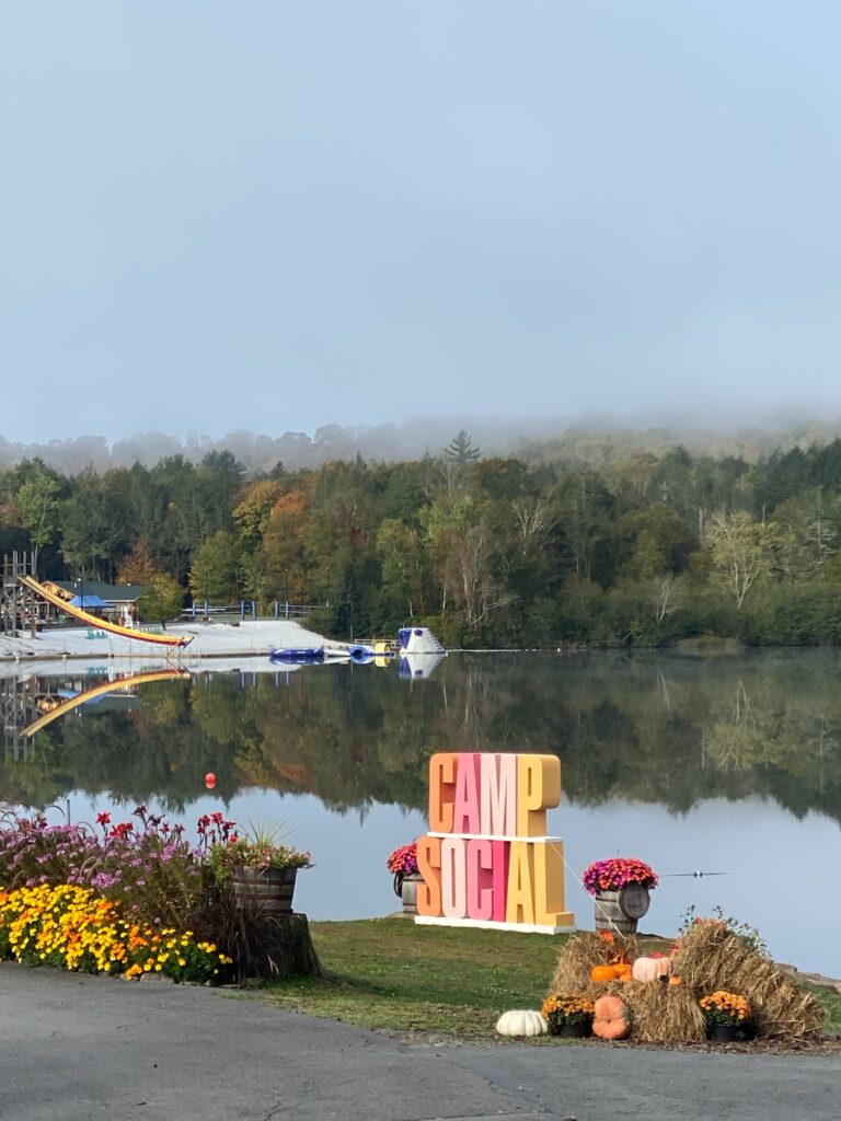 View of the lake with a Camp Social sign