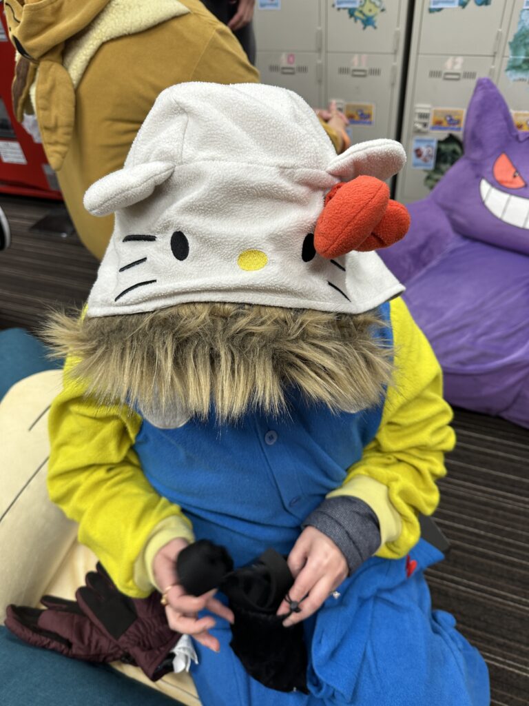 Woman wearing a Hello Kitty onesie