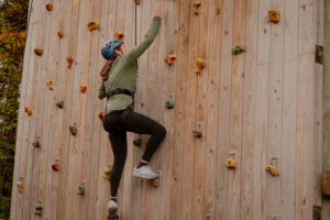 Woman workout clothing wall climbing outdoors